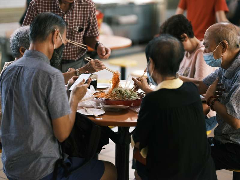 Elderly Men Sharing Meals Together